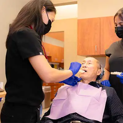Dental professional preparing extraction care