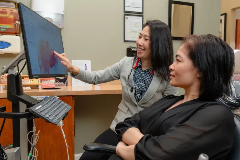 Dr. Hien Nguyen with a patient at Carabelli Dental